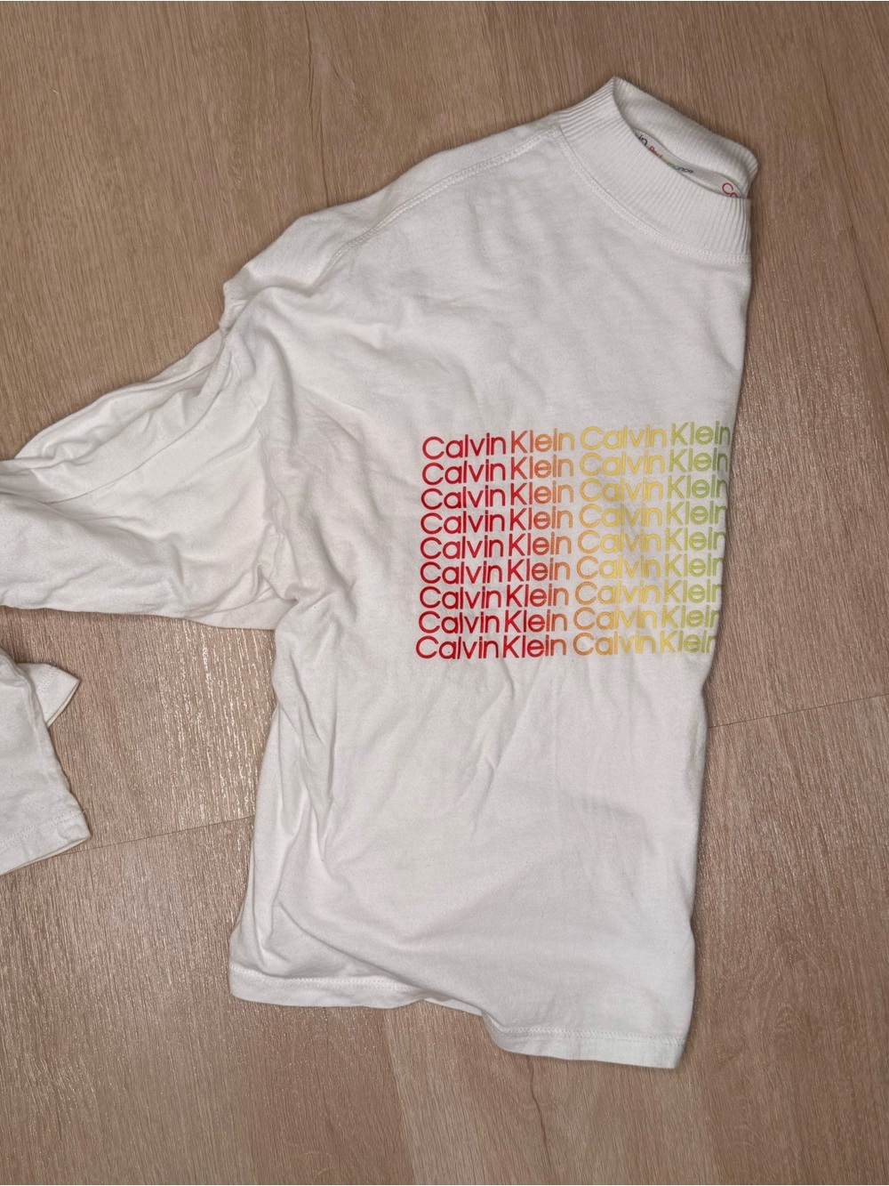 Calvin Klein White Tee with Red-Orange-Yellow Gradient Logo